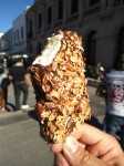 Vanilla ice creams in chocolate with oats and nuts.