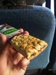 A crunchy cereal bar with oats and with a blackberry filling.