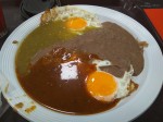 Huevos divorciados con salsa verde y roja y frijoles - Rancher's eggs with red and green salsa and fried beans.