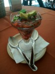 Mexican seafood cocktail with shrimps, tomatoes, onion, coriander and garnished with avocado.