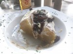 Papa al horno relleno con queso, carne y crema - Baked potato stuffed with meat, cheese and cream.