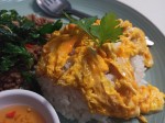 Omelet on rice with fried crispy basil leaves and minced pork meat