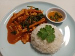 Red curry paste with fried young coconut and basil leaves served with rice