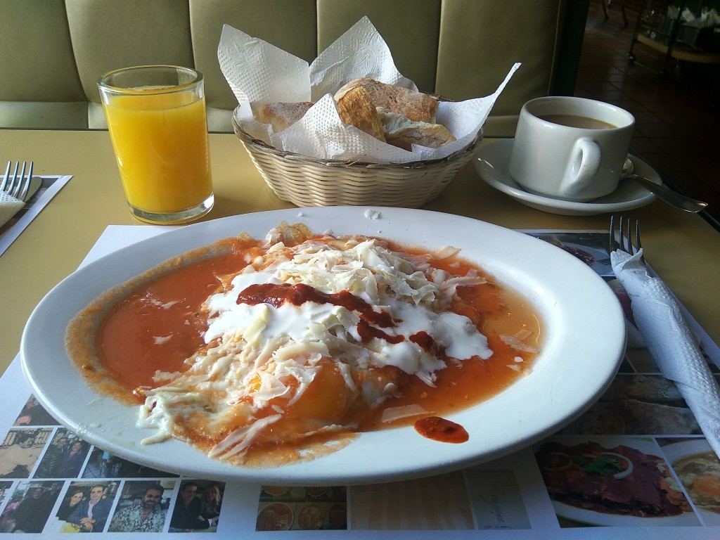 Regional Mexican breakfast specialties - Huevos revueltos a la Zacatecas (scrambled eggs with meat, served with salsa roja and cheese)- Acrópolis rastaurant.