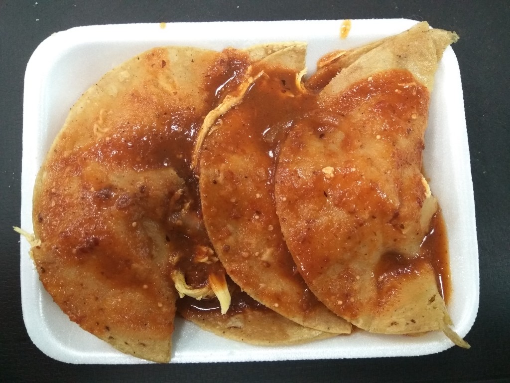 Enchiladas with chicken and red salsa. Enchiladas with chicken and red salsa.