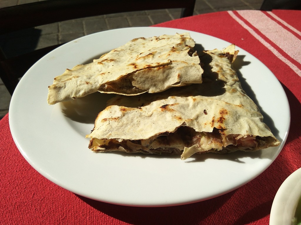 A cheese quesadilla with chicken.