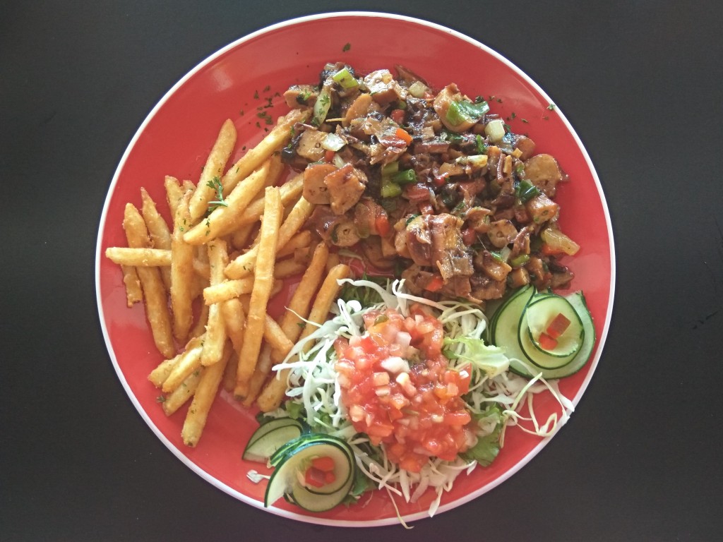 Grilled squids with fries and salad with topatoes - Costa Rica