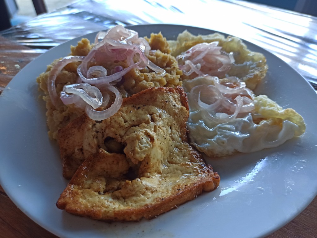 Desayuno dominicano - Mangu de plátano con queso frito, huevo frito - a traditional Dominican breakfast.