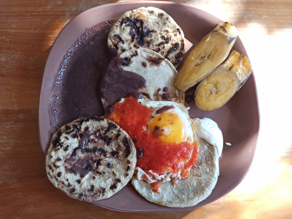 Desayuno Chapin with eggs, red beans, platans, cream or fresh cheese and tortillas