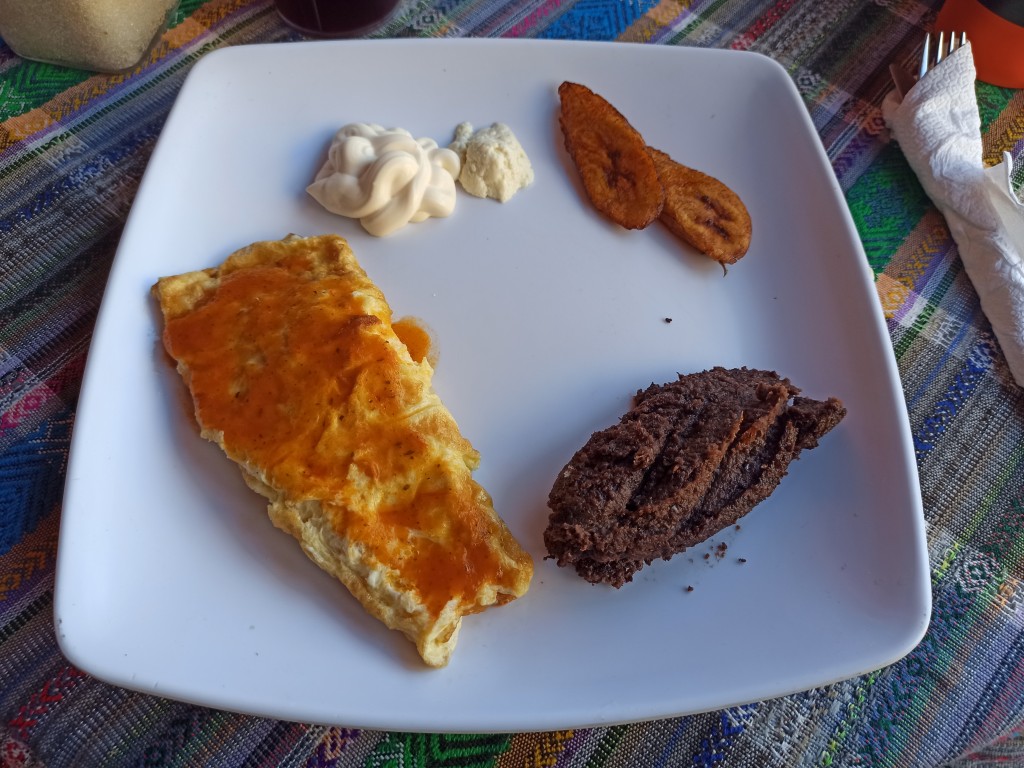 Desayuno Chapin with eggs, red beans, platans, cream or fresh cheese and tortillas