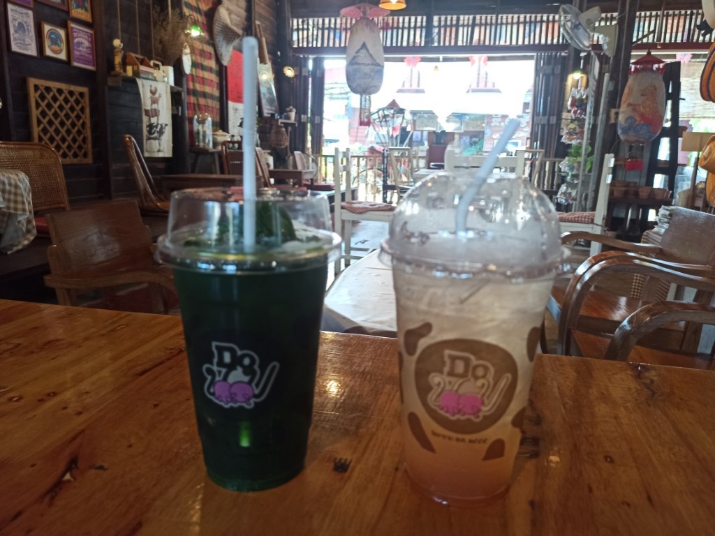 Have a refreshing Thai green tea and a longan soda in Photharam