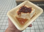 Hard tofu with soy sauce and bonito flakes - fermented, dried and smoked fish flakes.