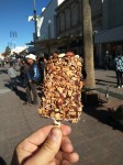 Vanilla ice creams in chocolate with oats and nuts.