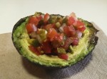 Avocado stuffed with a fresh salsa made of tomatoes, onion, jalapeno pepper and coriander.
