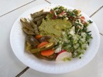 Cancun - guacamole from a food stall with onions, coriander and pickles.