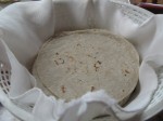 Warm tortillas served in a covered bread basket.