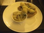 Wiener schnitzel with cabbage and boiled potatoes.