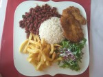 Casado with salad garnished with onion slices - Costa Rica
