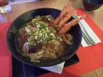Soup with Udon noodles and shrimps in tempura 
