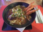 Soup with Udon noodles and shrimps in tempura 