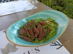 Keto Beef steak salad with nuts and tomatoes