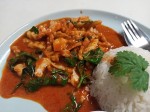 Red curry paste with fried young coconut and basil leaves served with rice