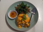 Omelet on rice with fried crispy basil leaves and minced pork meat
