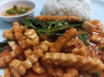 Red curry paste with fried young coconut and basil leaves served with rice