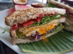 Toasts with eggs and vegetables served with fresh fruits