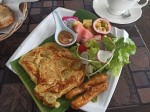 Banana pancakes with honey and fruits