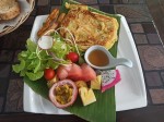 Banana pancakes with honey and fruits