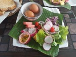 Hard boiled eggs with toasts, vegetables and fruits Hard boiled eggs with toasts, vegetables and fruits