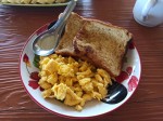 Scrambled eggs and toasts for a breakfast in the Thai jungle