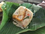 Banana leaf lunch box for a meal during the jungle trekking in Thailand - fired rice with egg