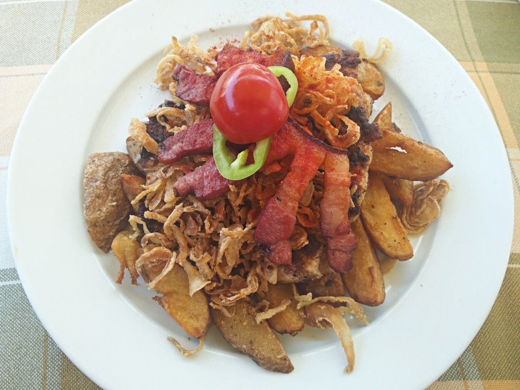 Roasted pork with fried onion, bacon, and potatoes Roasted pork with fried onion, bacon, and potatoes