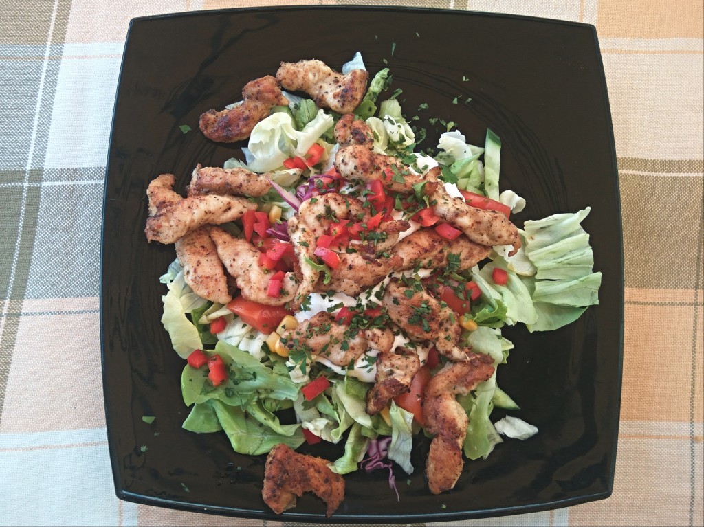 Salad served with chicken and a mayo sauce. Salad served with chicken and a mayo sauce.