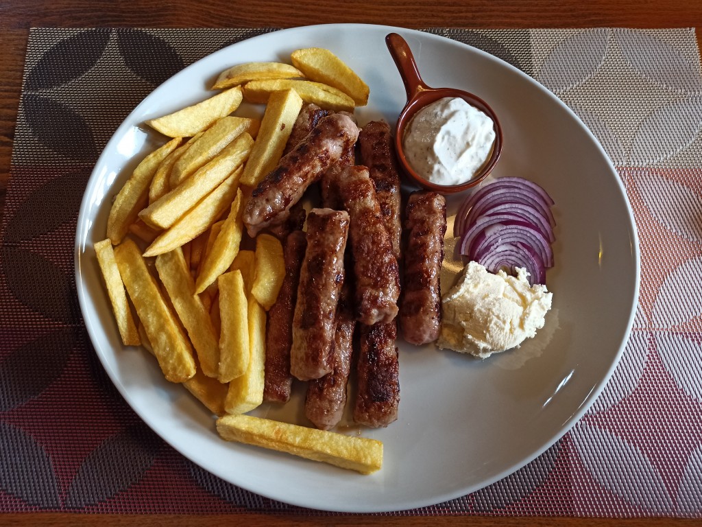 Montenegrin Ćevapi with cream and fries Montenegrin Ćevapi with cream and fries