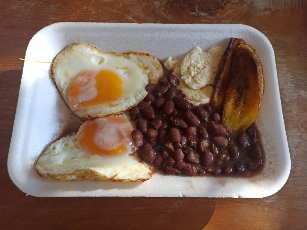 Desayuno chapin consisting of fried beans, eggs – scrambled or fried, platans, fresh cheese and/or cream and tortillas